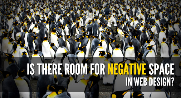 a crowd of penguins on the beach - where's the negative space?